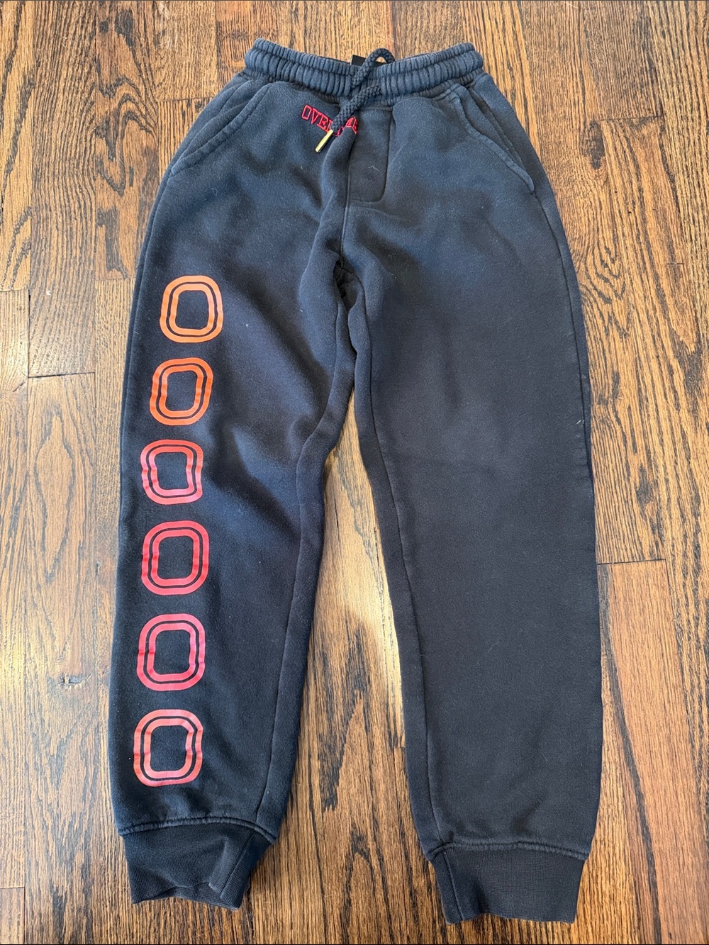 Kids Black Joggers with Red and Orange Circle Accents